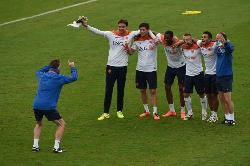 Netherlands players pose for Coach Louis van Gaal during a team training session in Rio de Janeiro on Monday.