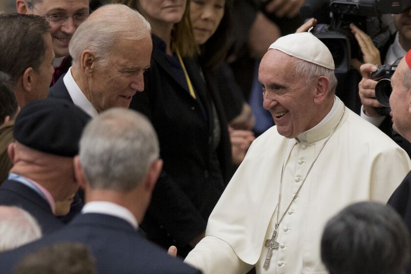 Vice President Joe Biden shakes hands with Pope Francis at the Vatican on Friday during a conference on regenerative medicine.
