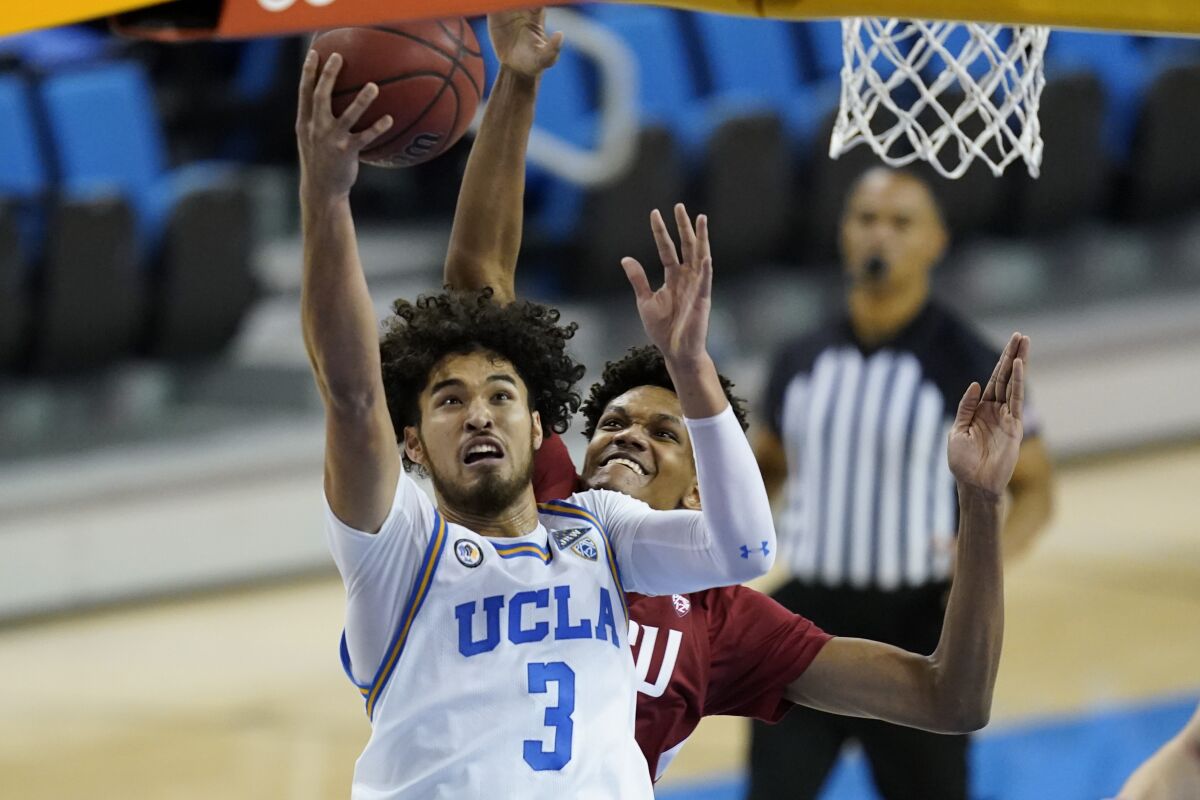 UCLA guard Johnny Juzang shoots