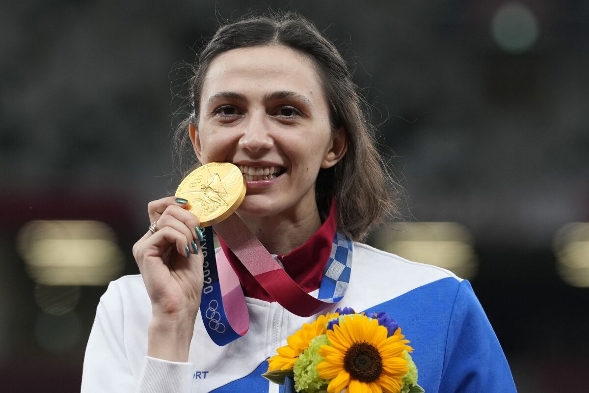 Gold medalist Mariya Lasitskene of Russia celebrates after the women's high jump at the Summer Olympics last year.