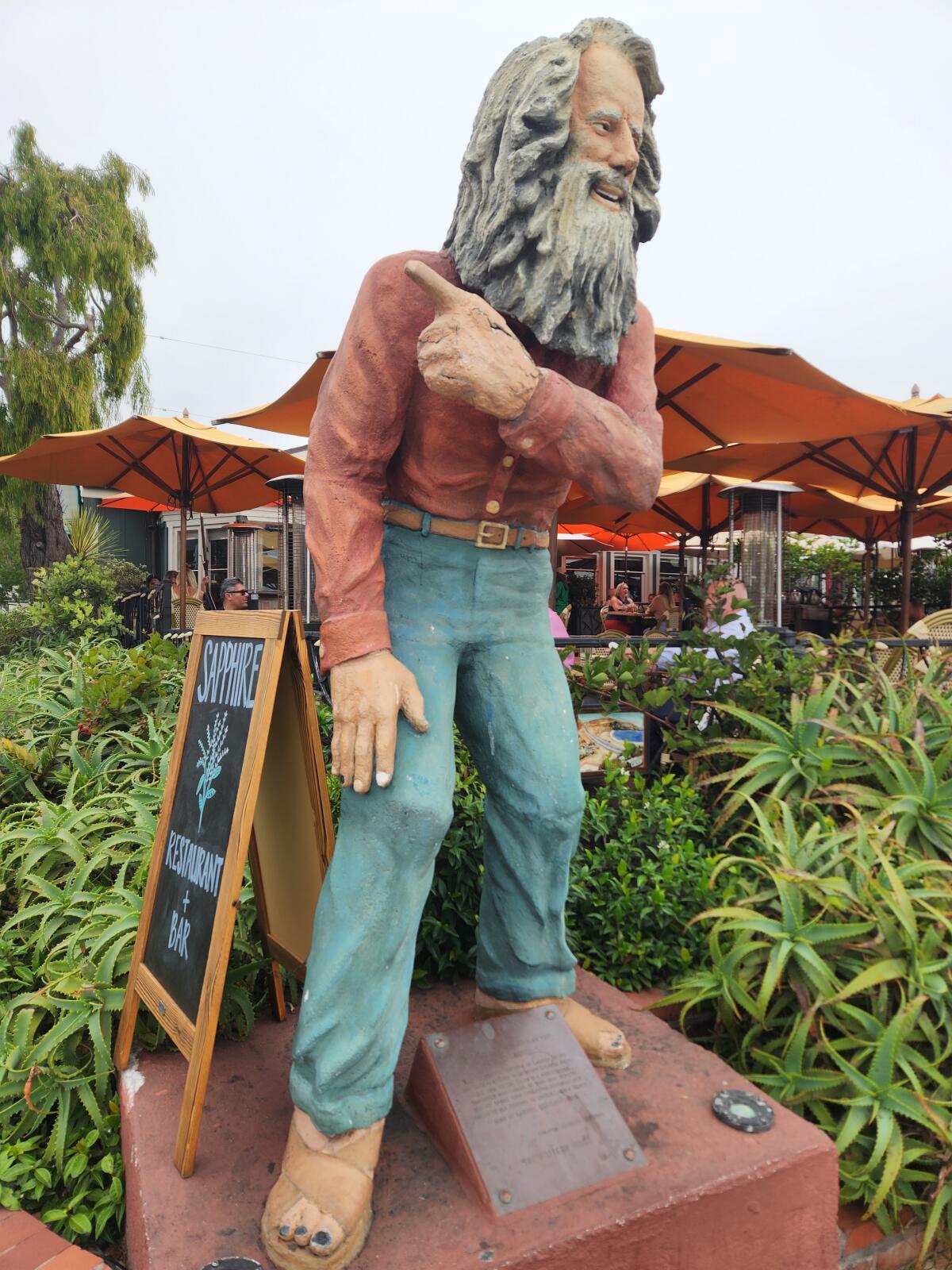A statue pays tribute to the original Laguna Beach greeter Eiler Larsen on the corner of Brooks Street and Coast Highway.