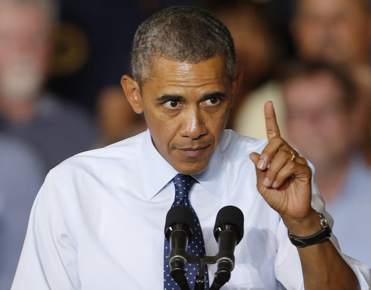 President Obama gestures during a speech in Liberty, Mo.