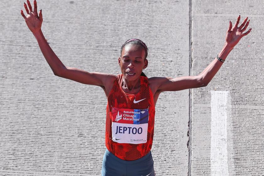 Rita Jeptoo of Kenya celebrates after winning of the Chicago Marathon on Oct. 12.