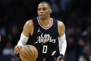 Los Angeles Clippers guard Russell Westbrook brings the ball up court against the Charlotte Hornets