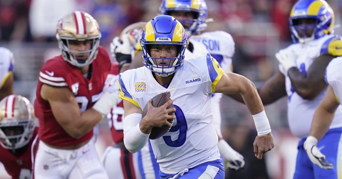 Los Angeles Rams quarterback Matthew Stafford connects with wide receiver  Tutu Atwell downfield for a 31-yard touchdown