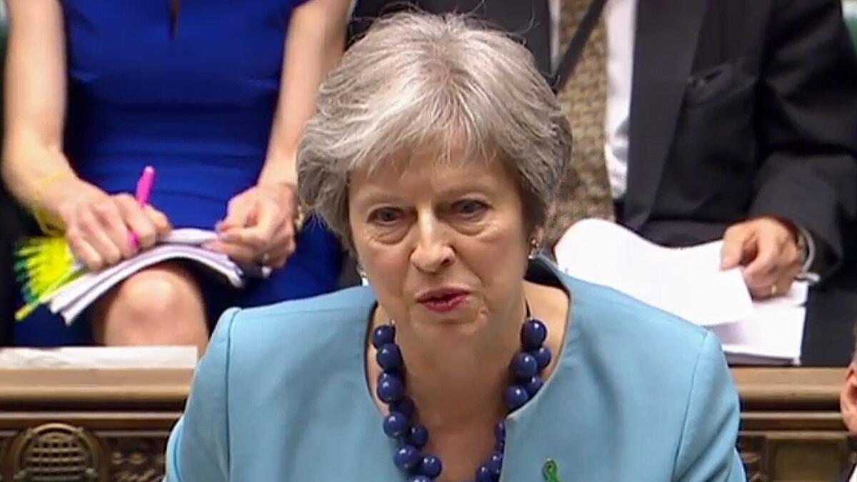 In an image from video broadcast by the Parliamentary Recording Unit, British Prime Minister Theresa May speaks in the House of Commons in London on May 16, 2018.