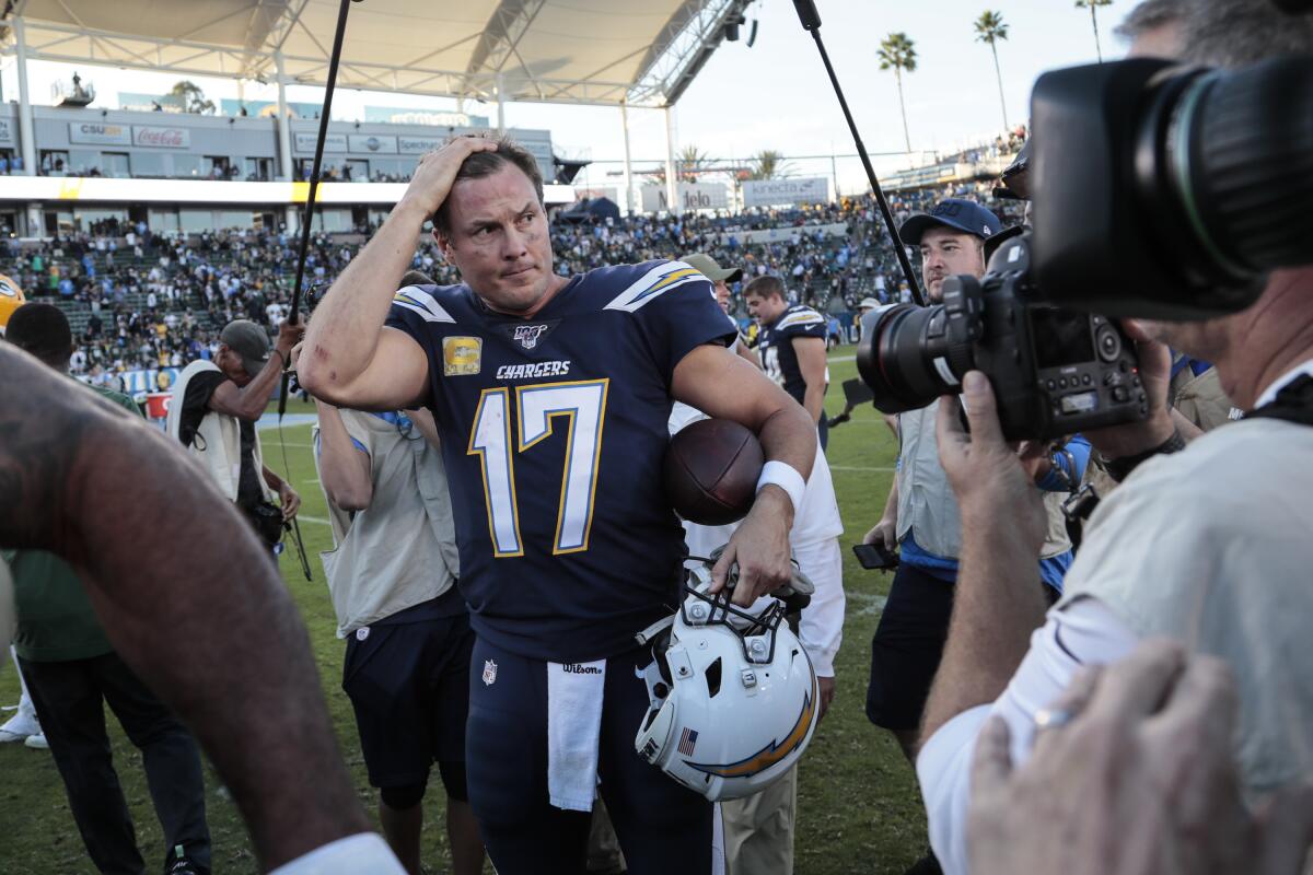 Chargers quarterback Philip Rivers walks off the field after a win over the Green Bay Packers on Nov. 3.