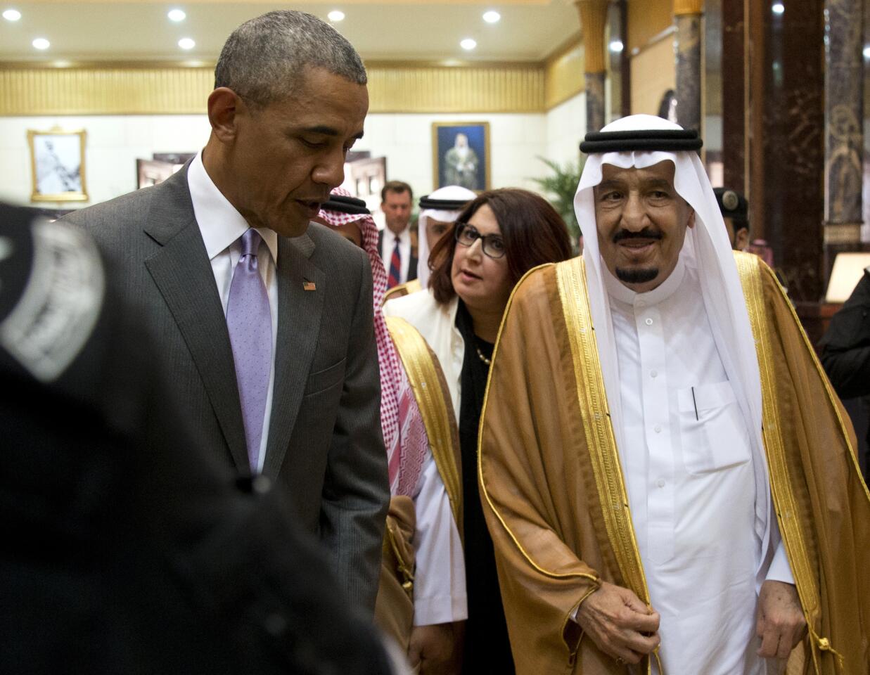 President Barack Obama and Saudi Arabia's King Salman walk together to a meeting at Erga Palace in Riyadh, Saudi Arabia, Wednesday, April 20, 2016.