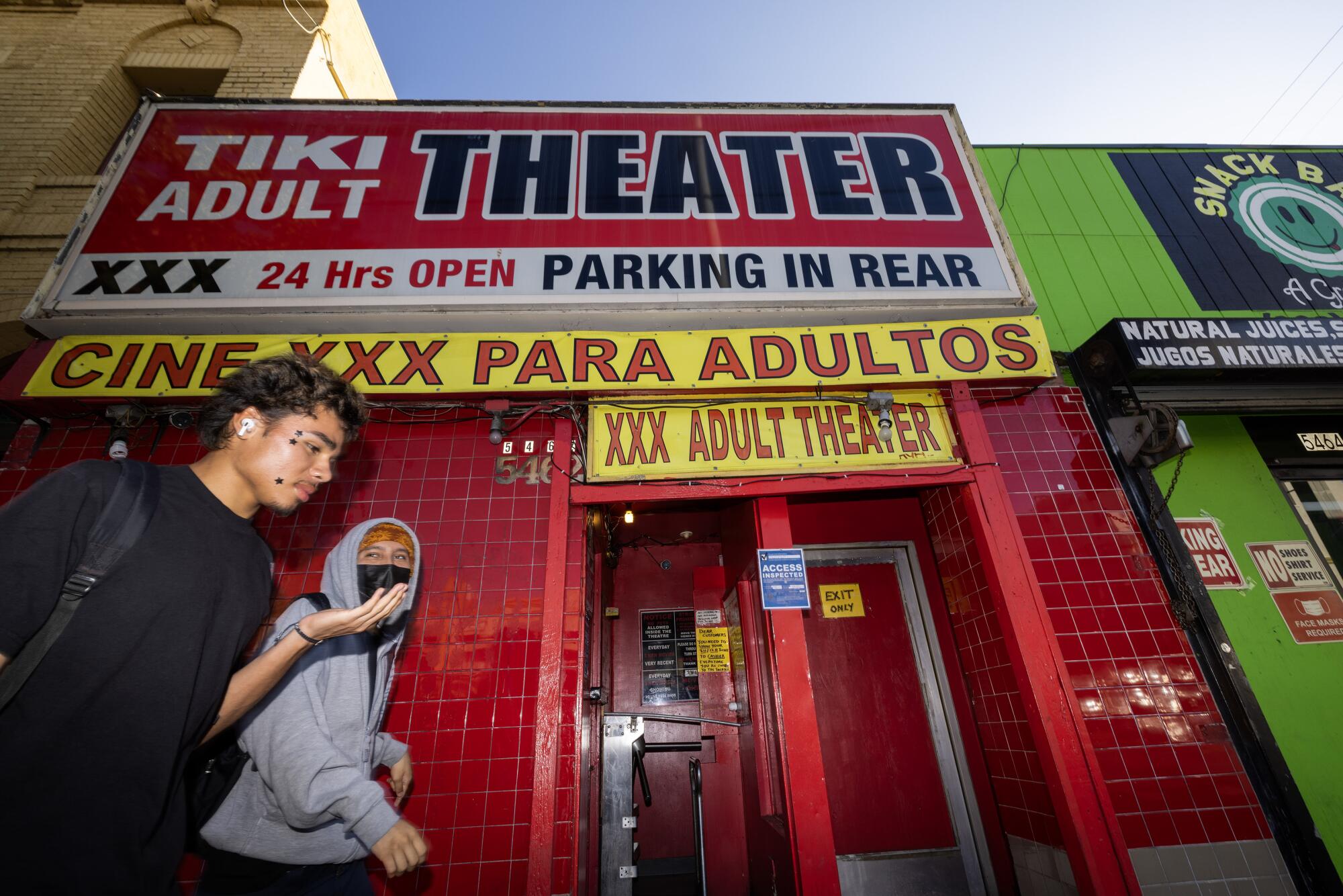 Passersby in front of the Tiki Theater in East Hollywood.