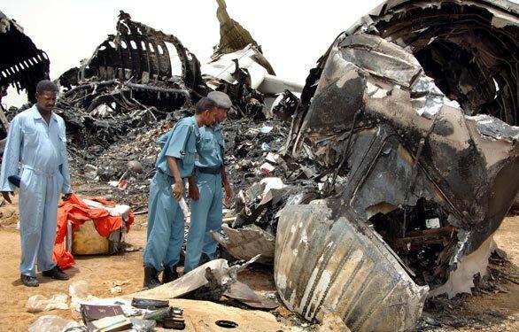 Wednesday: The Day in Photos, Sudan airliner crash