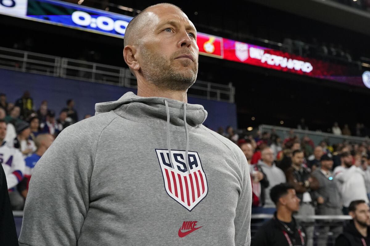 U.S. coach Gregg Berhalter stands during the national anthem before an international friendly match against Ghana in October.