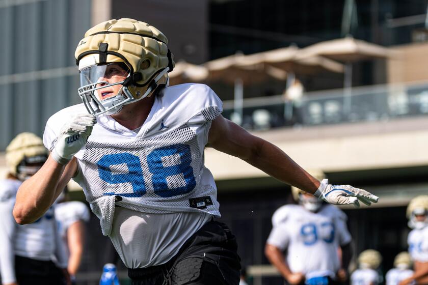 UCLA defensive lineman Luke Schuermann takes part in a practice drill in 2024.