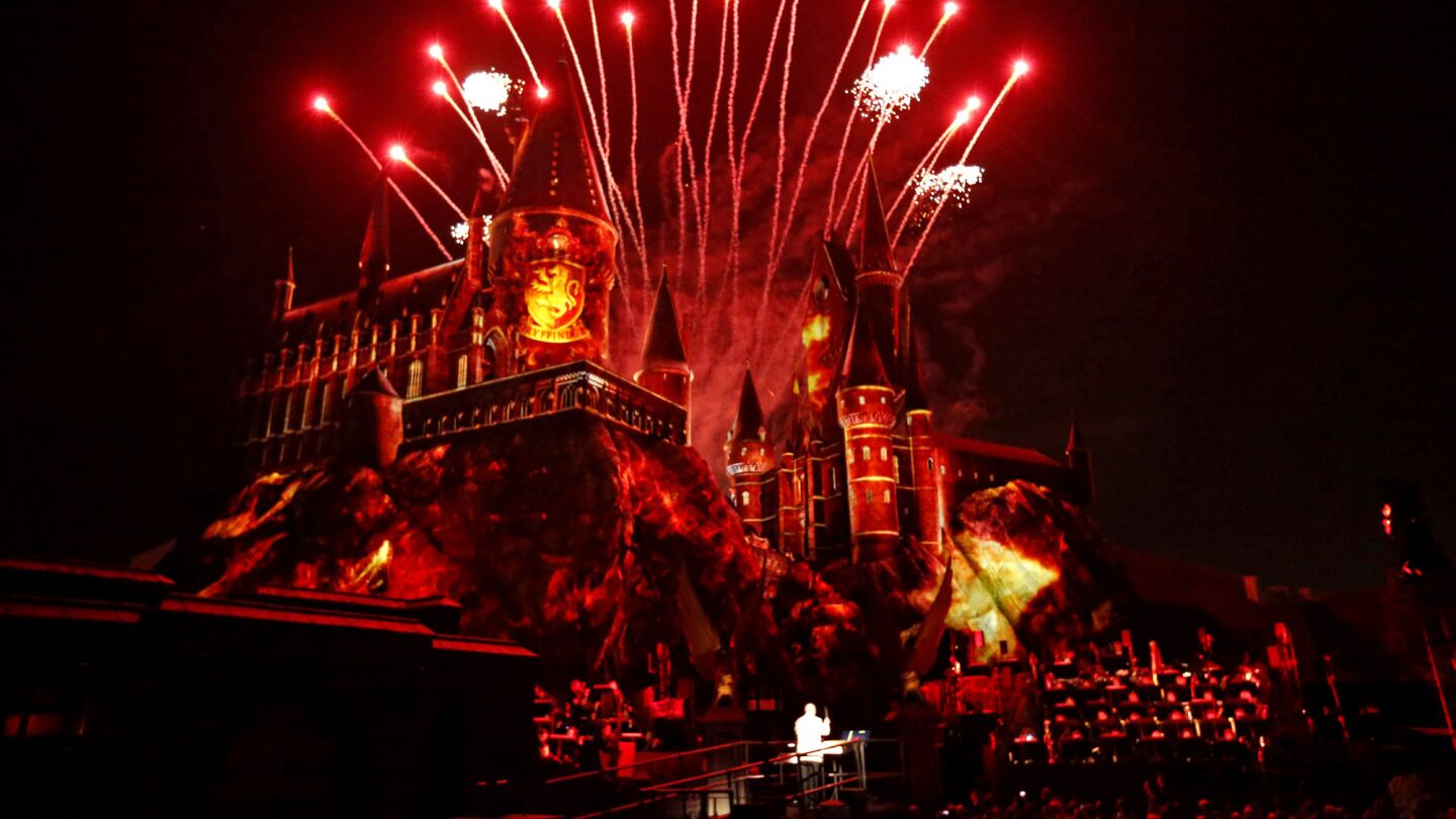 Fireworks go off over Hogwarts castle as composer John Williams conducts the Los Angeles Philharmonic at the Wizarding World of Harry Potter VIP debut.