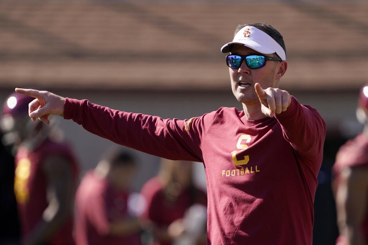 USC coach Lincoln Riley gestures during a team practice in March.