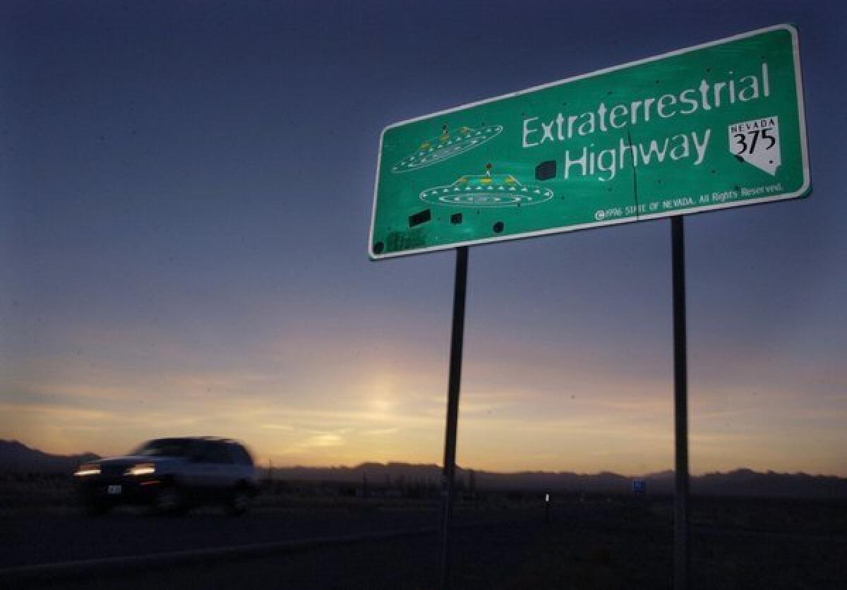 A car moves along the Extraterrestrial Highway near Rachel, Nev., and Area 51.
