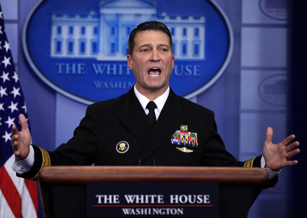 Ronny Jackson speaks to reporters during a press briefing 
