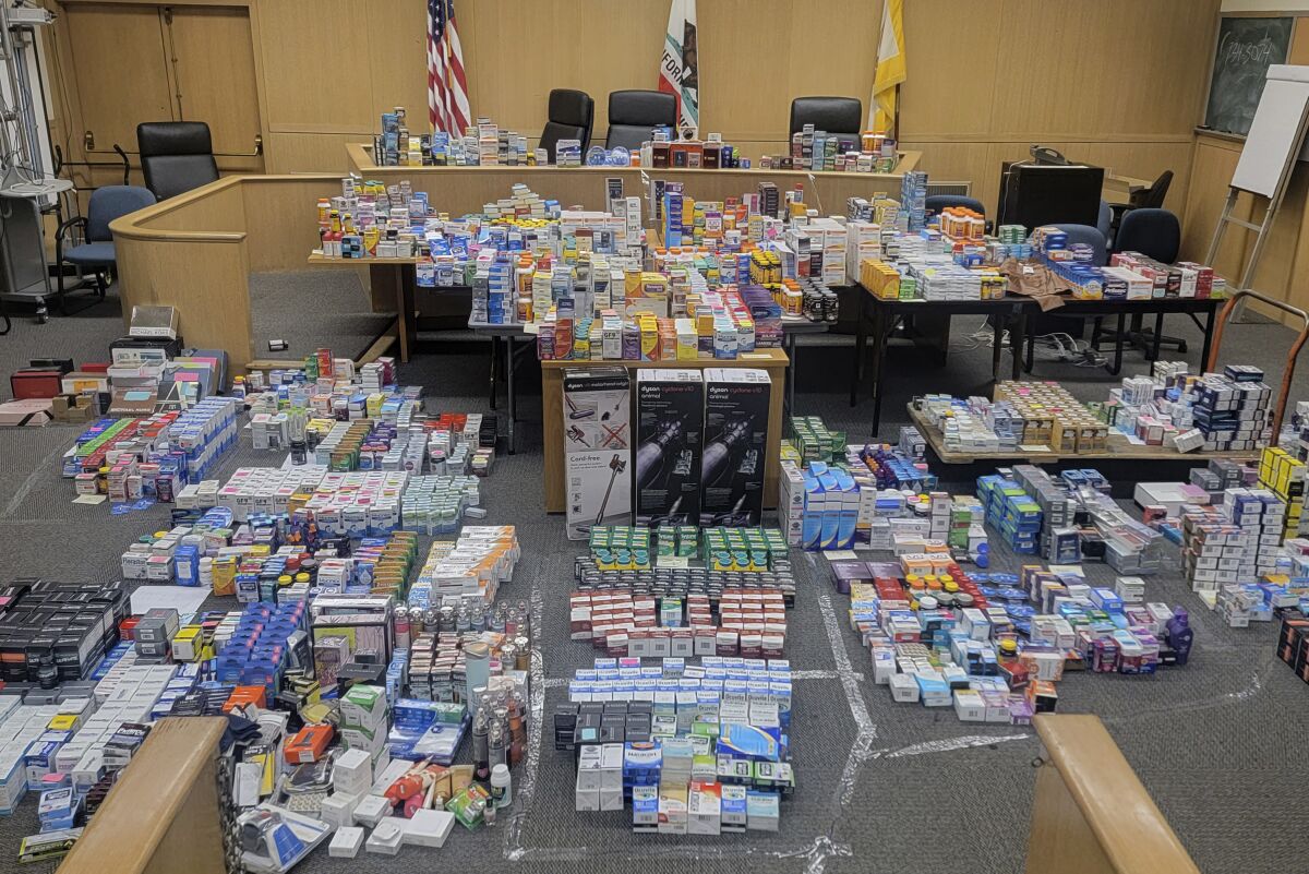 In this photo released by the San Francisco Police Department are some of the more than $200,000 in stolen retail goods seized from a home this week in San Francisco. Police arrested a man they say has made $500,000 annually selling stolen over-the-counter medication and personal care products online. Investigators found the stolen items Wednesday, July 13, 2022, during a search of a home in the Ingleside neighborhood following a monthslong investigation. (San Francisco Police Department via AP)