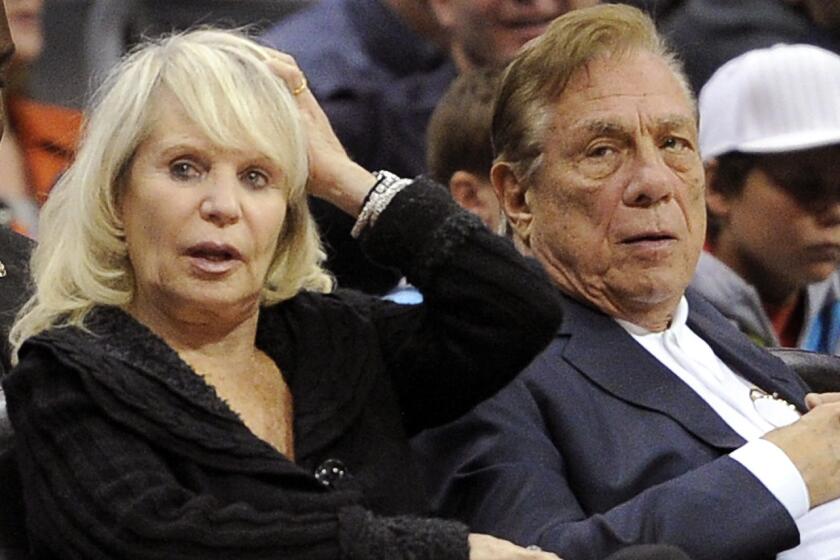 Clippers owners Shelly, left, and Donald Sterling watch the Clippers play the Detroit Pistons in 2010. Shelly Sterling is attempting to rush a sale of the team before the NBA owners will be asked to strip control of the team from both of the Sterlings.