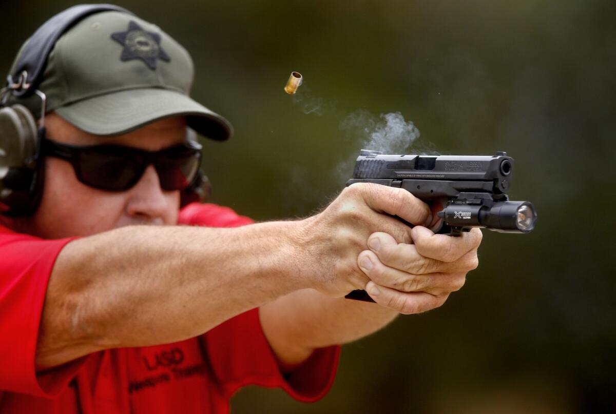 L.A. County Sheriff's Department weapons training instructor Sgt. Mike Brandriff fires his Smith & Wesson at the Pitchess Detention Center gun range.