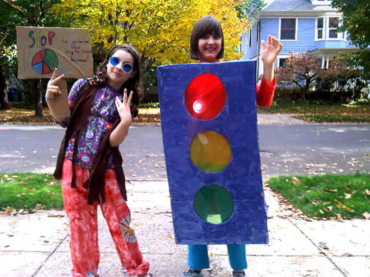 Sisters Gabi, left, and Maya Karlan in costume for Halloween.