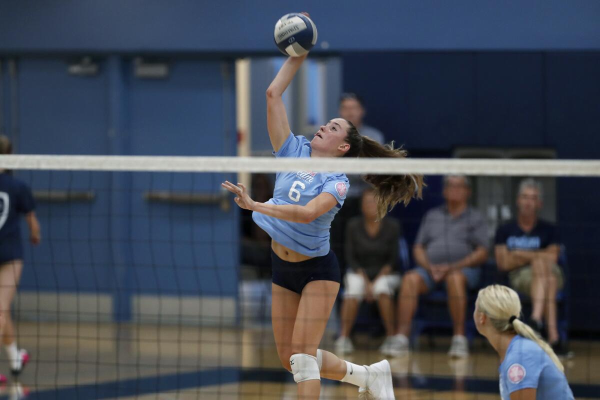 Corona del Mar's Molly Joyce spikes the ball for a point against Trabuco Hills in the first set of a nonleague home match on Thursday.