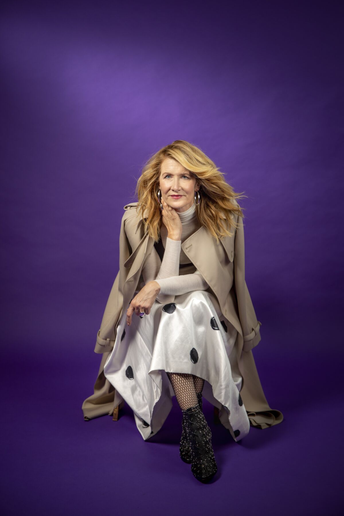 Laura Dern against a royal purple backdrop