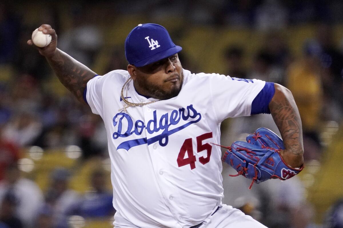 Dodgers relief pitcher Reyes Moronta delivers during the ninth inning Saturday.