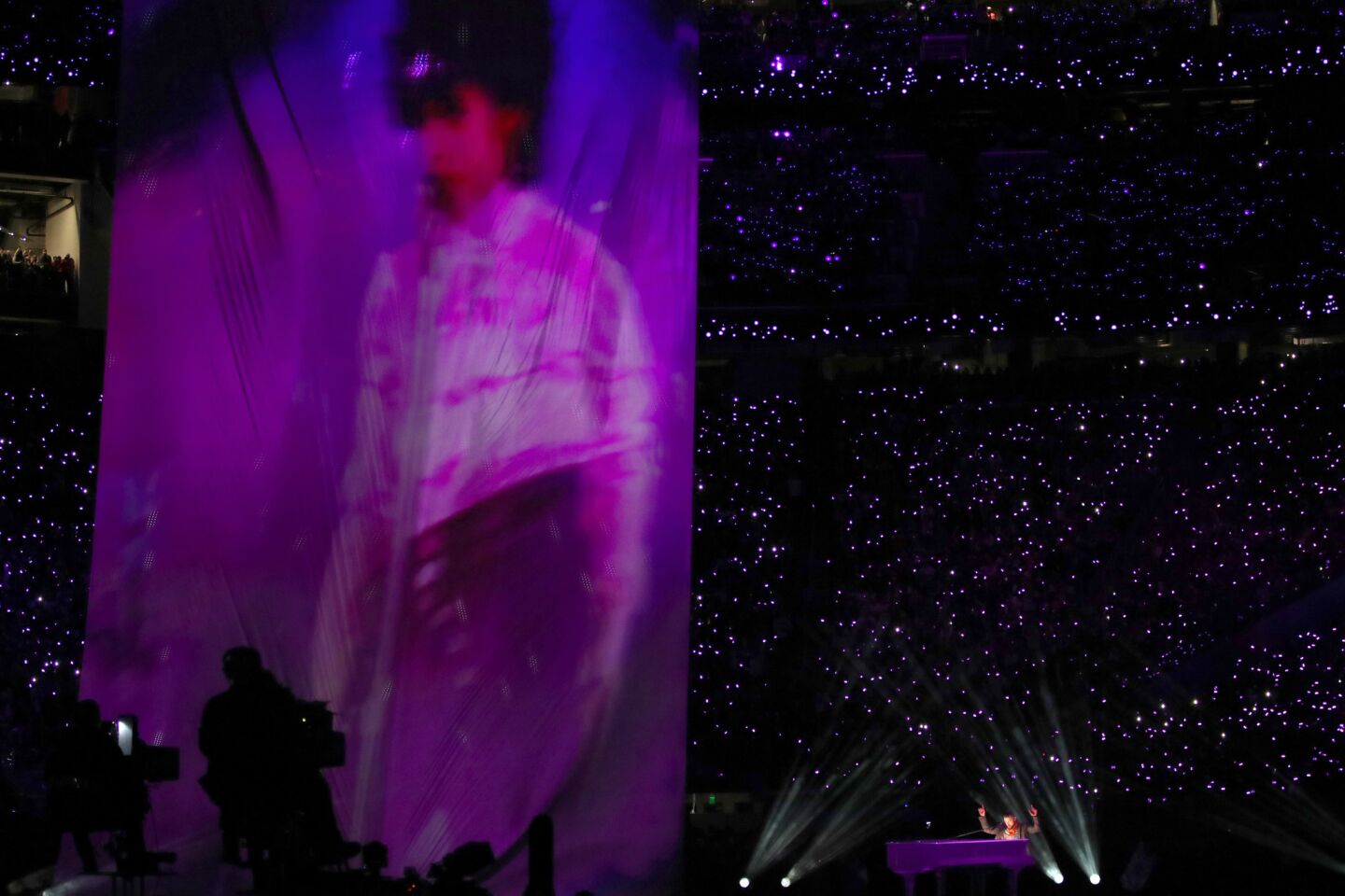 Justin Timberlake performs as an image of the late Prince is projected onto a screen.
