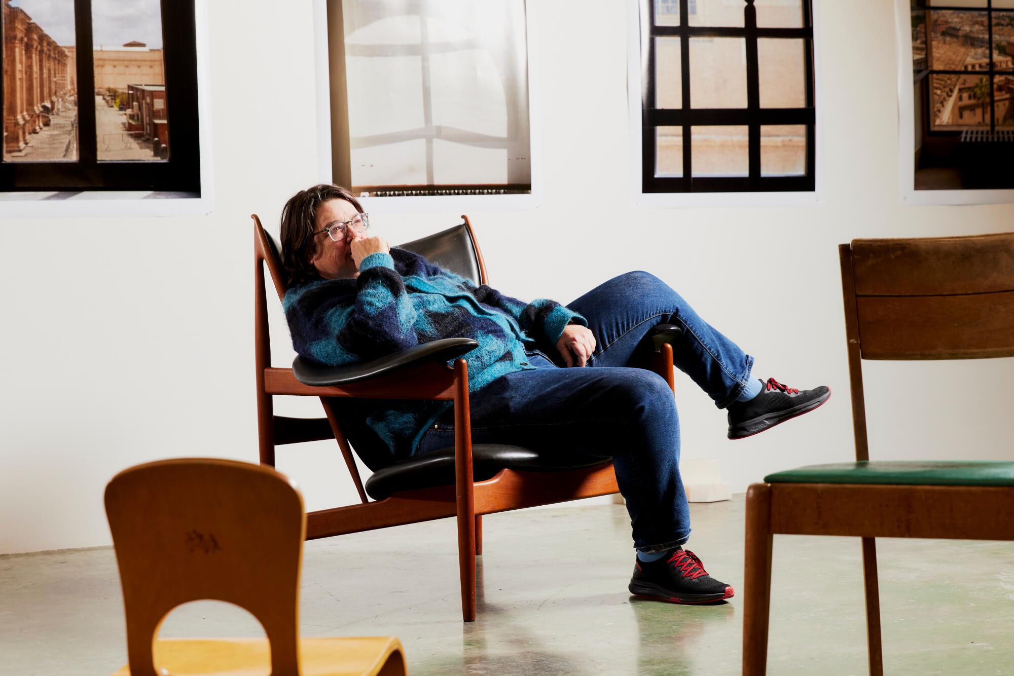 Catherine Opie in her Finn Juhl Chieftain chair.