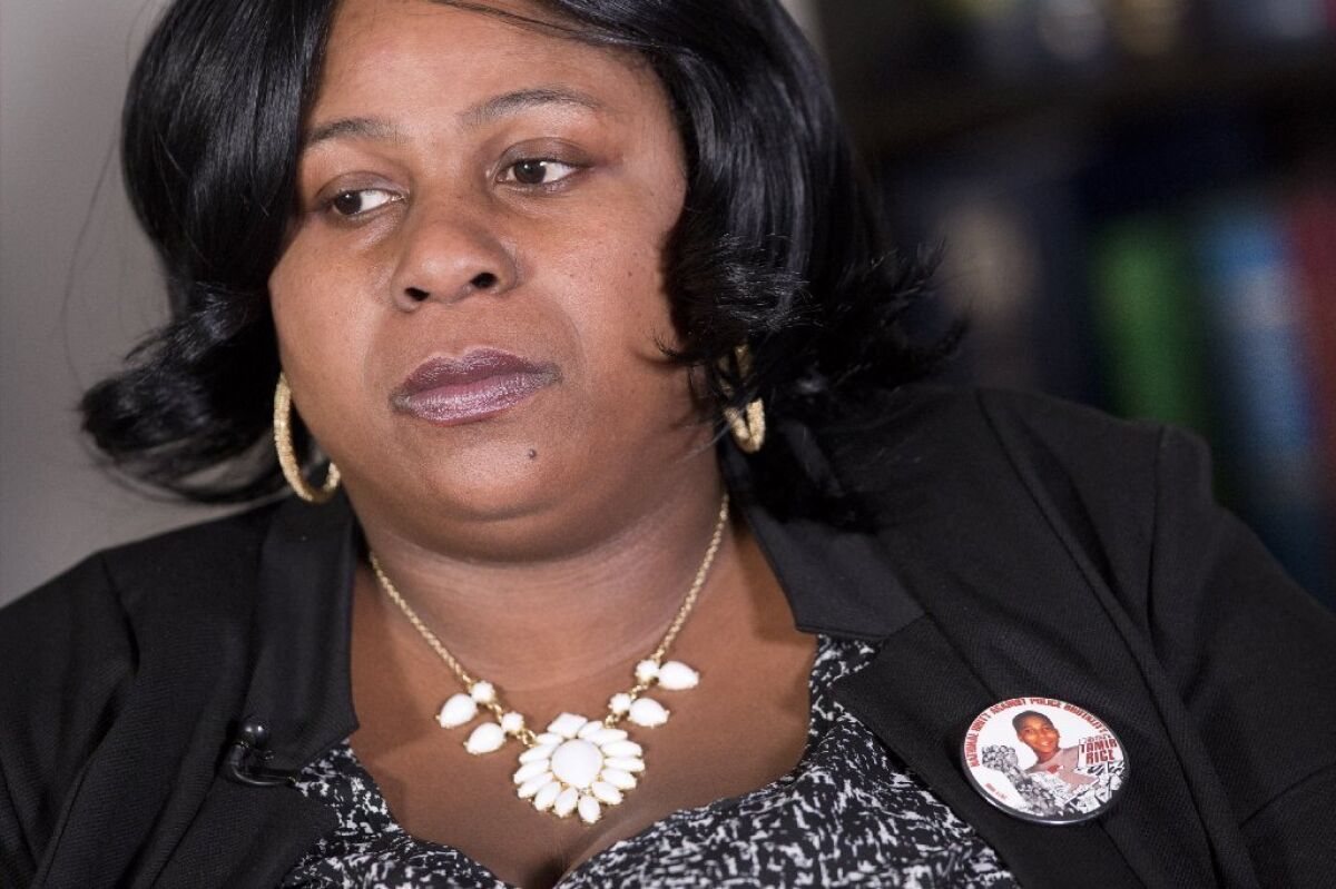 Samaria Rice, the mother of Tamir Rice, wears a button featuring her son's picture at a December interview.