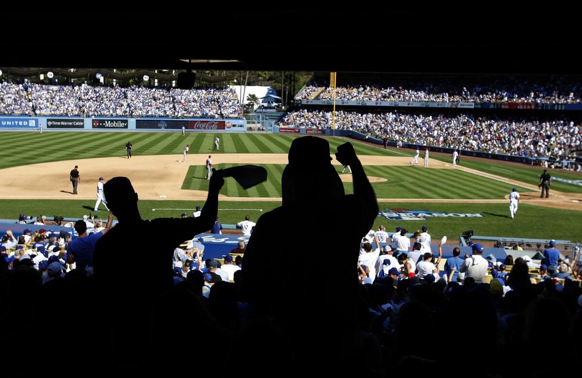 Fans cheer on the Dodgers during Game 5 of the National League Championship Series against the St. Louis Cardinals on Oct. 16.