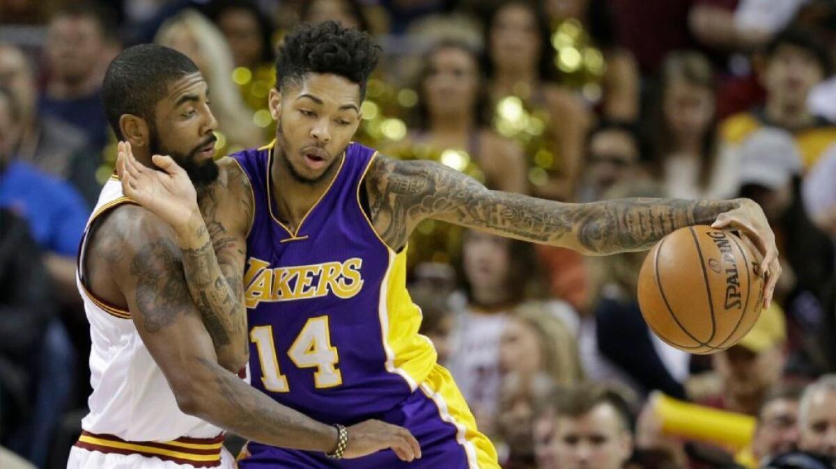 Lakers guard Brandon Ingram drives against Cavaliers guard Kyrie Irving during the first half of a game on Dec. 17.