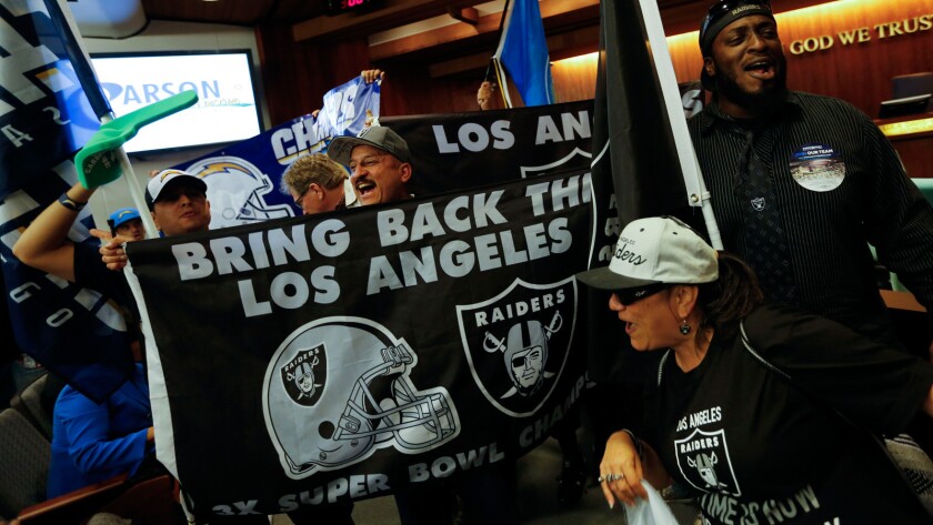 Raiders and Chargers fans gather for a tailgate party and rally before marching to Carson City Hall on April 21 to show support for a plan to build an NFL stadium to house both NFL franchises.