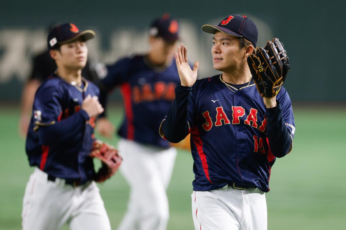 Yoshinobu Yamamoto reacts during a game for Japan at the World Baseball Classic.