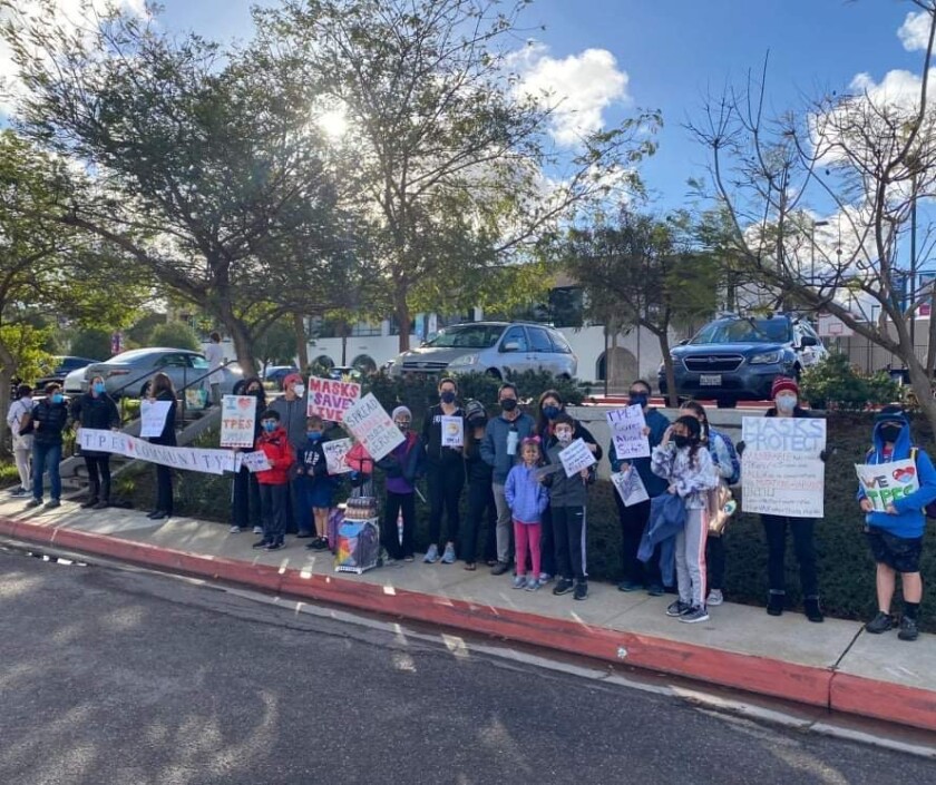 Torrey Pines Elementary parents and students participate in a rally Feb. 23 to show support for COVID-19 safety protocols.