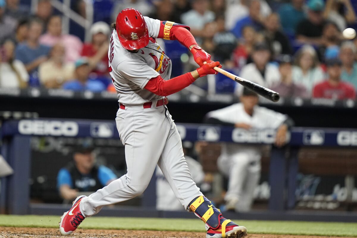St. Louis Cardinals' Nolan Arenado hits a two-run home run during the ninth inning of a baseball game against the Miami Marlins, Wednesday, April 20, 2022, in Miami. The Cardinals won 2-0. (AP Photo/Lynne Sladky)