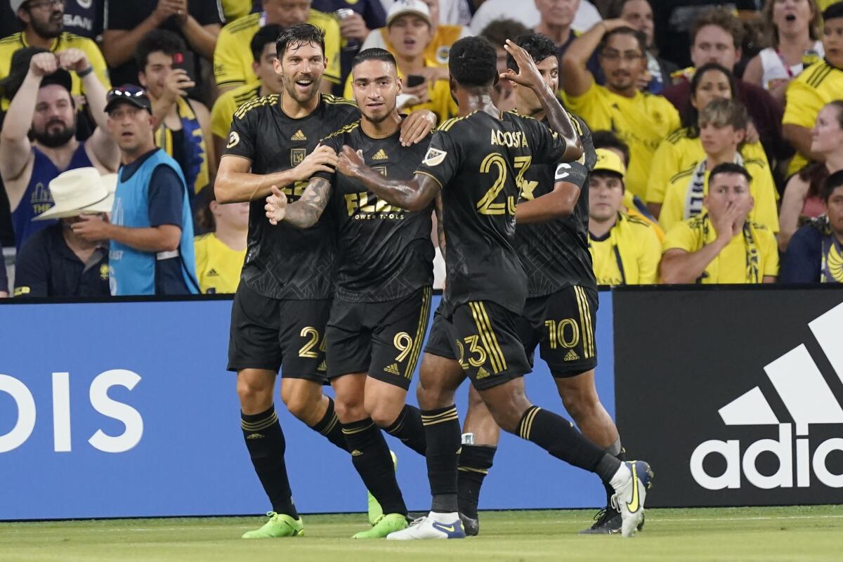 LAFC's Cristian Arango (9) is congratulated after scoring a goal against Nashville SC.