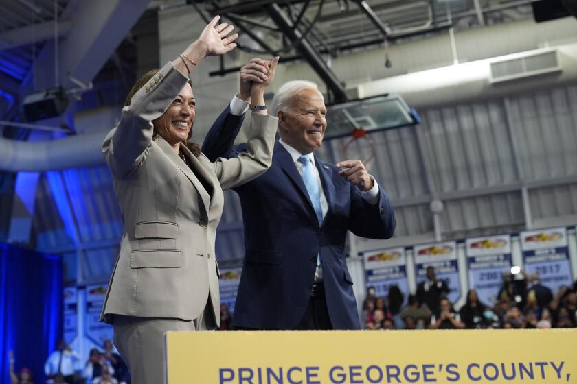 Democratic presidential nominee Vice President Kamala Harris, left, and President Joe Biden appear on stage after speaking about the administration's efforts to lower prescription drug costs during an event at Prince George's Community College in Largo, Md., Thursday, Aug. 15, 2024. (AP Photo/Susan Walsh)