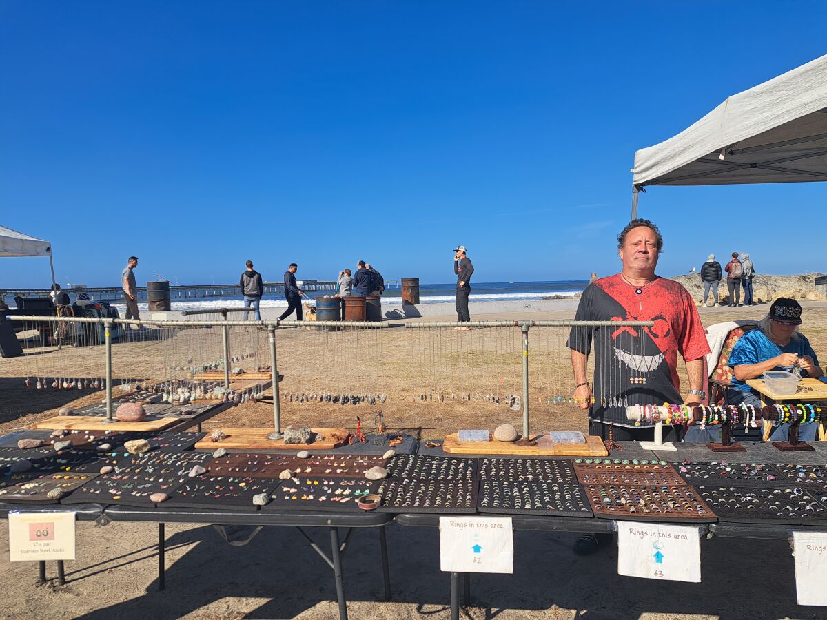 Mark Herpst stands at his jewelry display in Ocean Beach on Jan. 18.