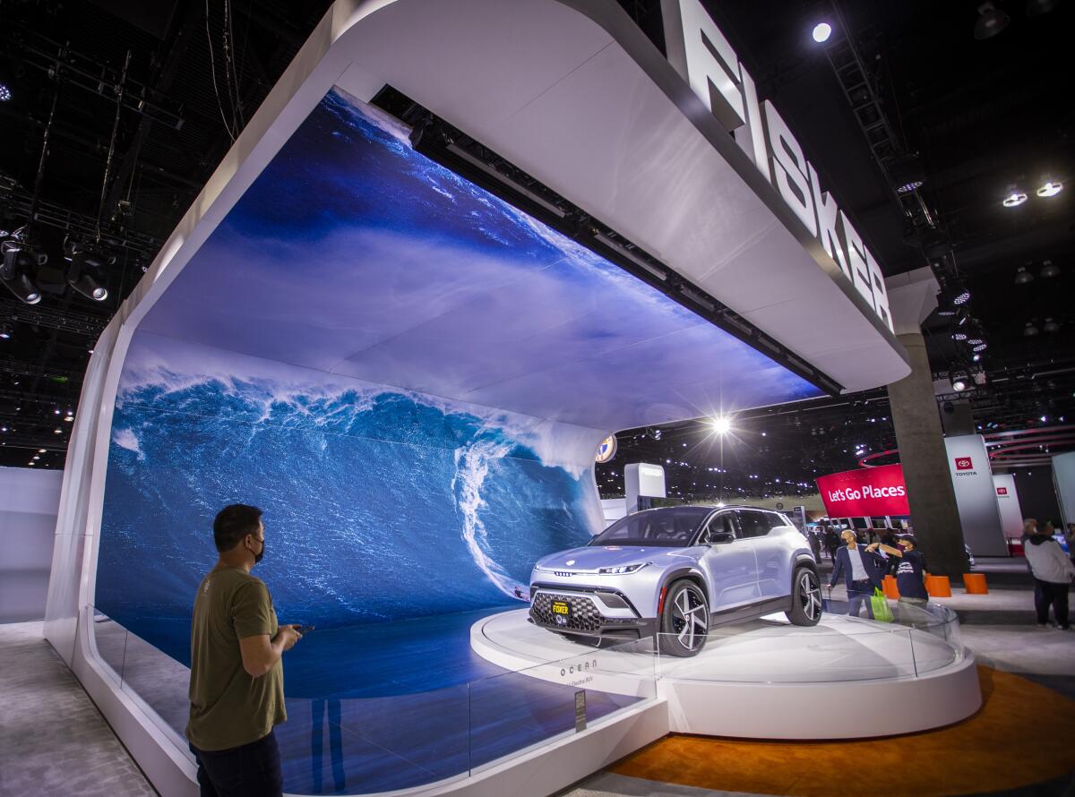 A display car is shown off surrounded by an electronic display of an ocean