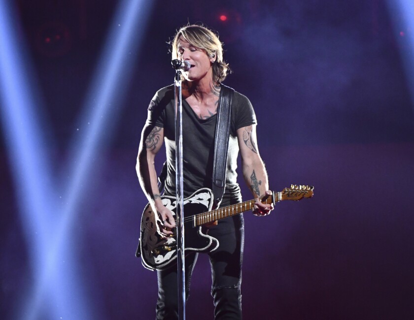 FILE - This Nov. 14, 2018 file photo shows Keith Urban performing at the 52nd annual CMA Awards in Nashville, Tenn.