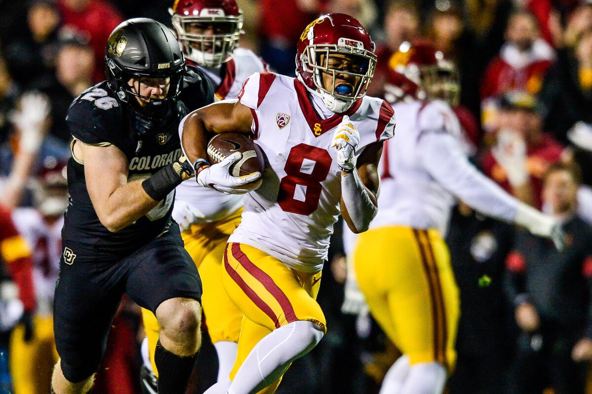 USC receiver Amon-Ra St. Brown scores a touchdown against Colorado during Friday's game at Folsom Field.