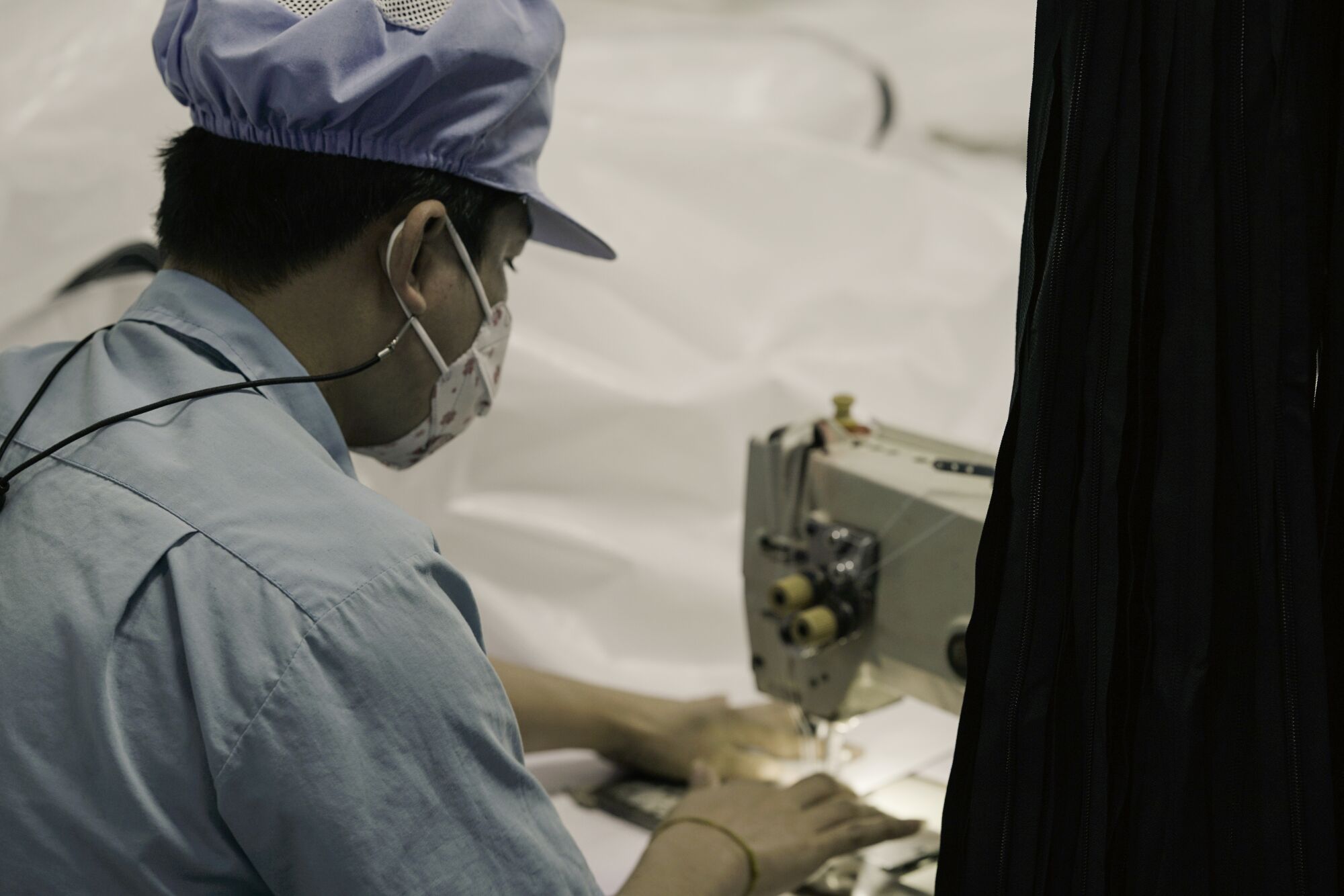 A worker at a sewing machine at a factory in Thailand