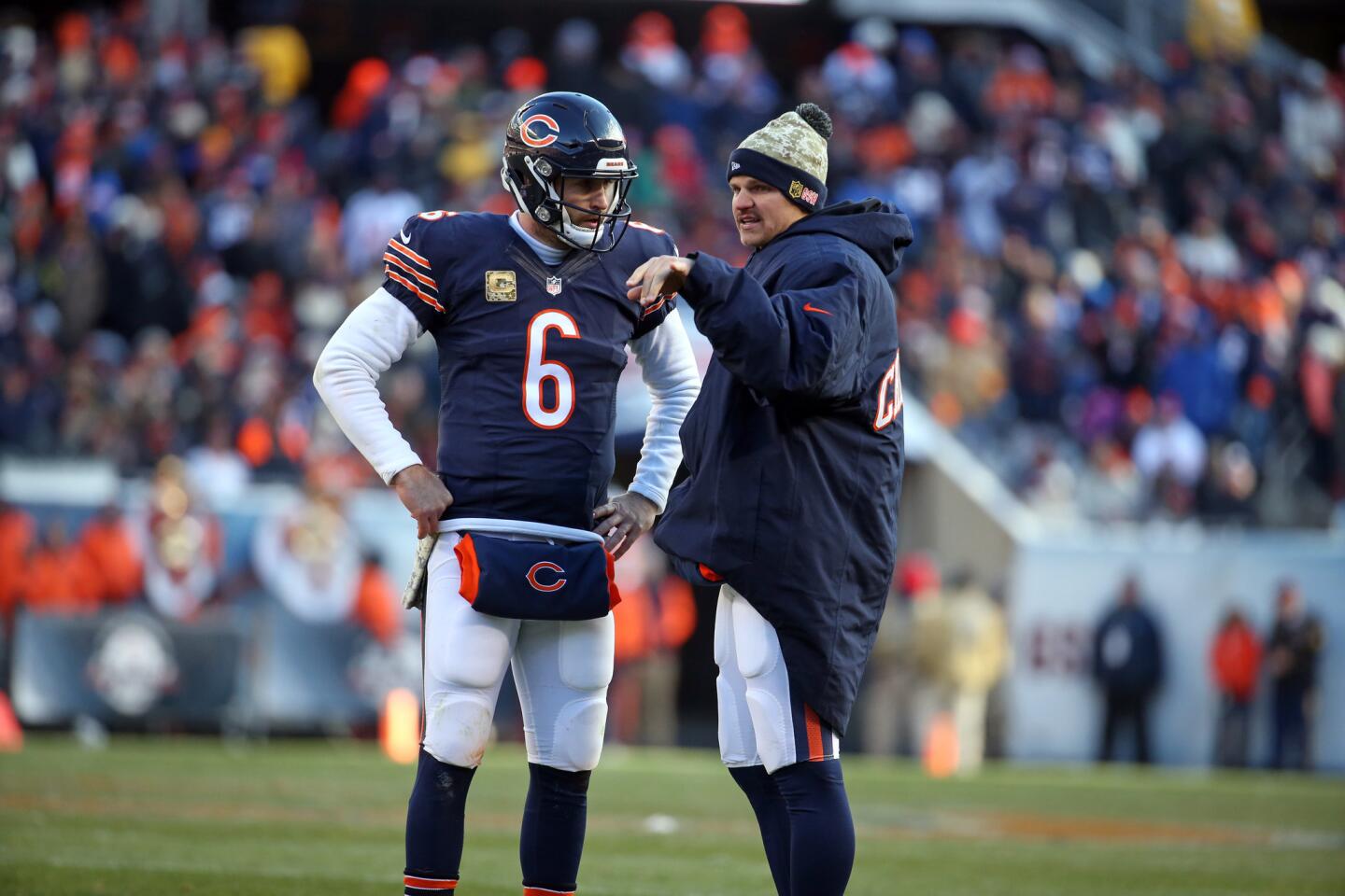 Bears quarterbacks Jay Cutler and Jimmy Clausen talk in the fourth quarter against the Broncos.