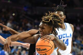 Los Angeles, CA - November 10: UCLA's. Dylan Andrews, while driving to the basket.