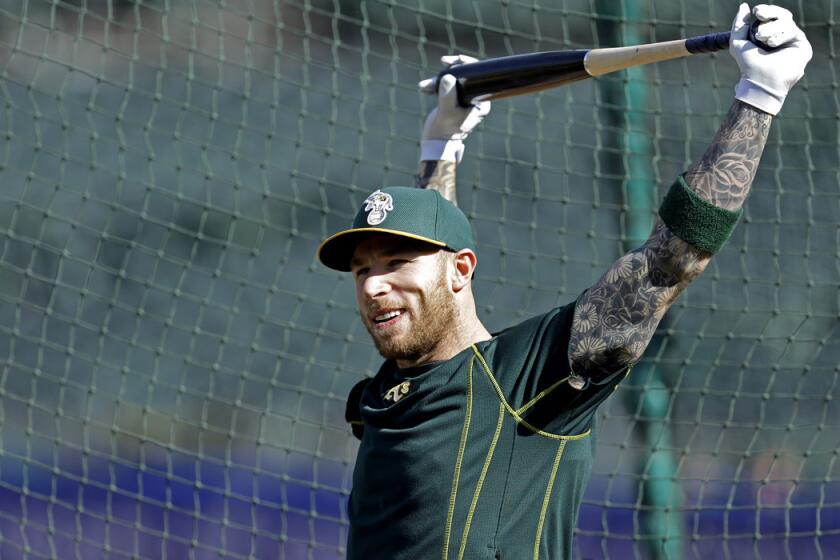 Oakland Athletics' Brett Lawrie stretches during batting practice before a game against the Houston Astros on Friday.