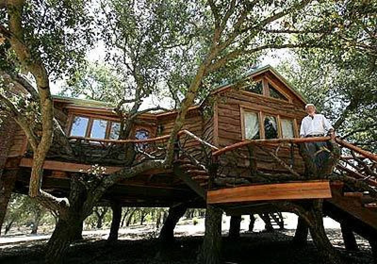 Kit and Karen Sickels whim resulted in a 980-square-foot treehouse with plumbing, electricity, heat and air conditioning, 10 feet off the ground, on their northern San Diego County property. It also features a brick fireplace.