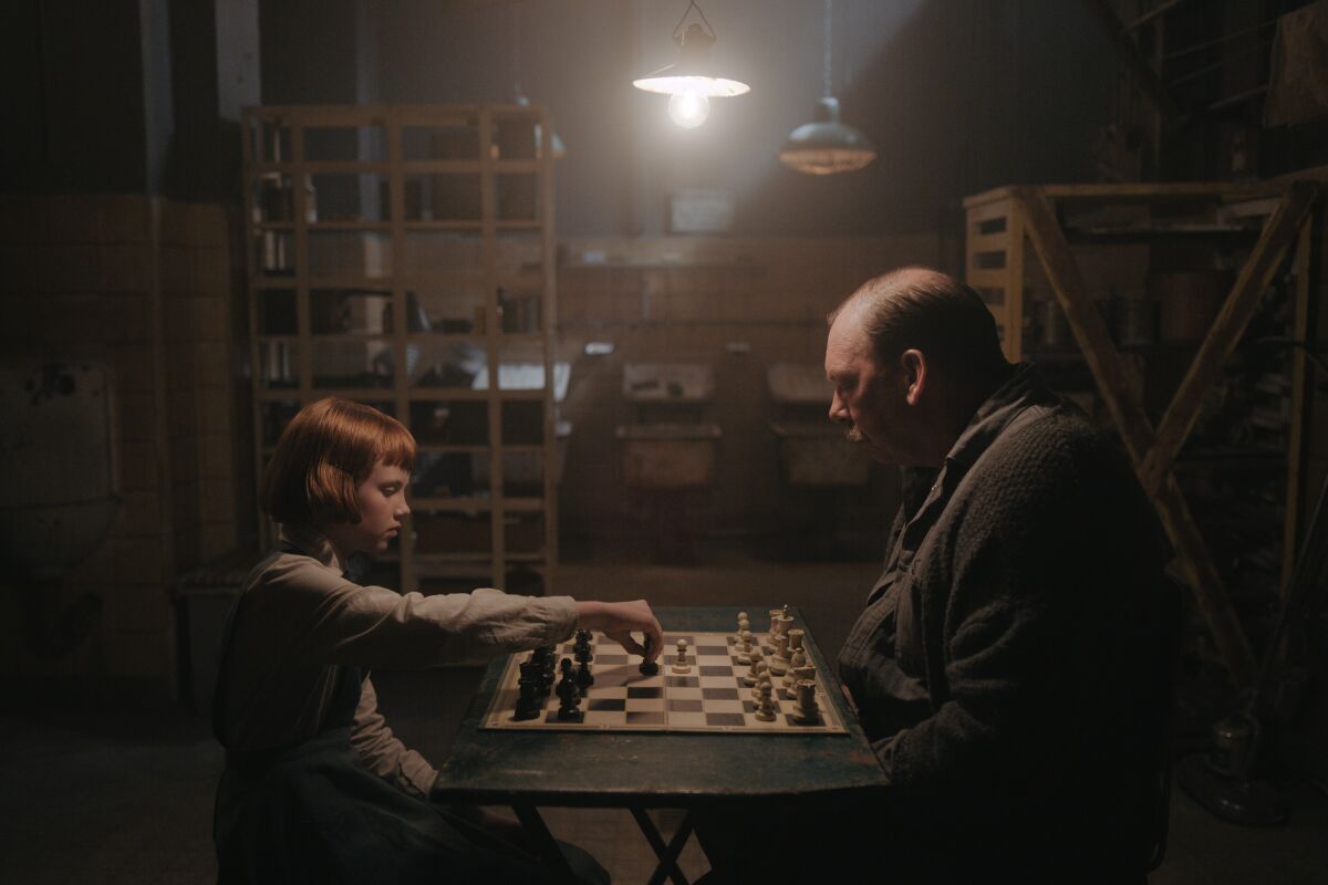 Isla Johnston and Bill Camp play chess in "The Queen's Gambit."