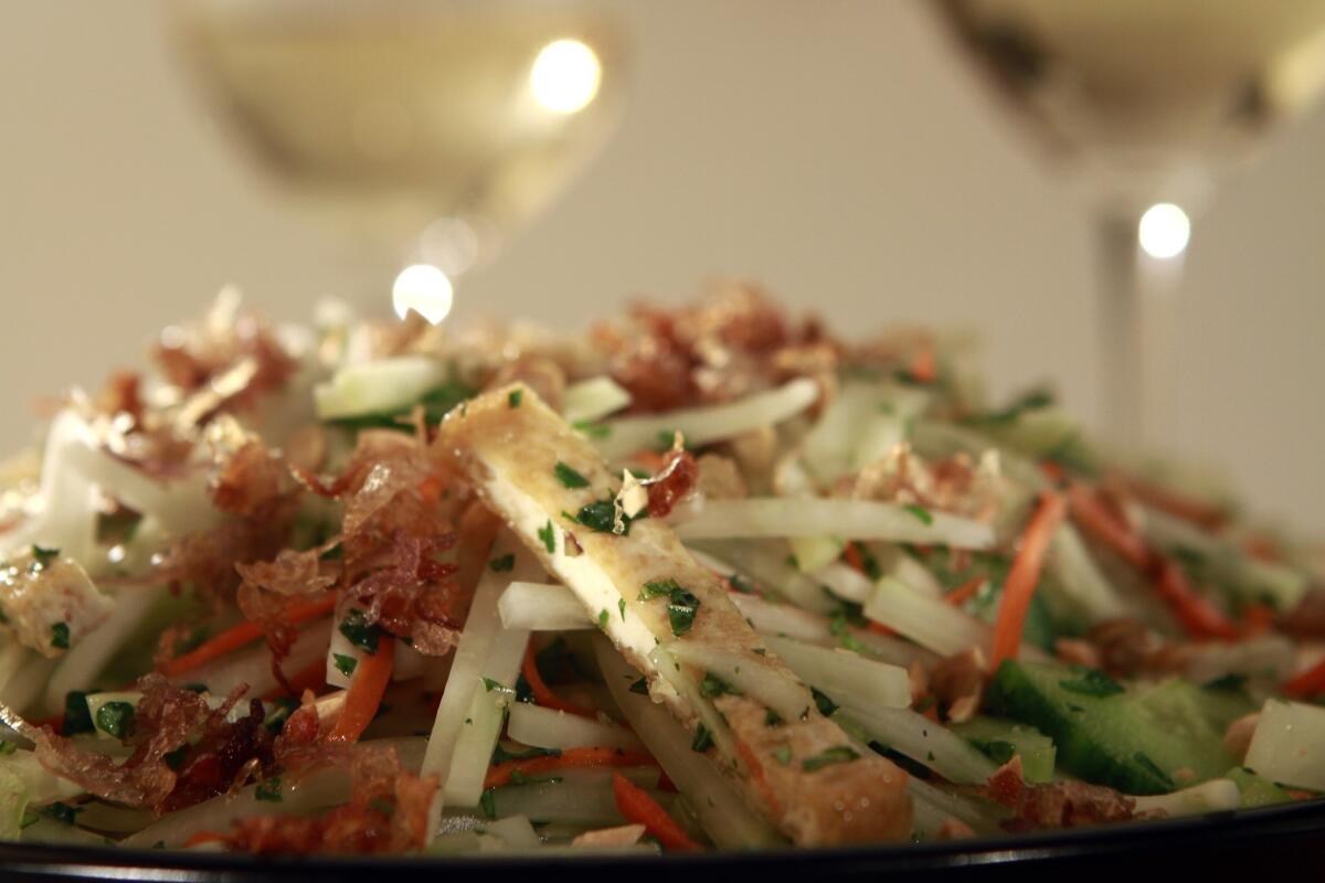 Green papaya salad and white wine.