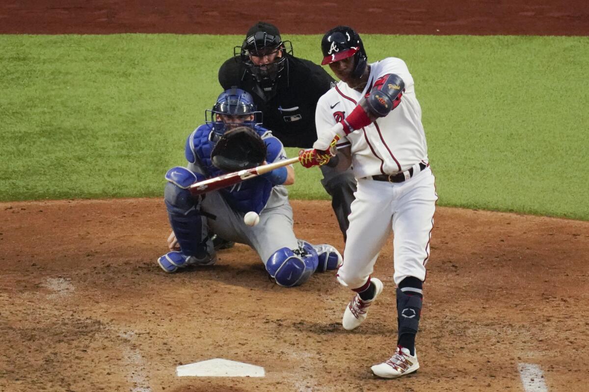 Atlanta's Cristian Pache hits a solo home run against the Dodgers.